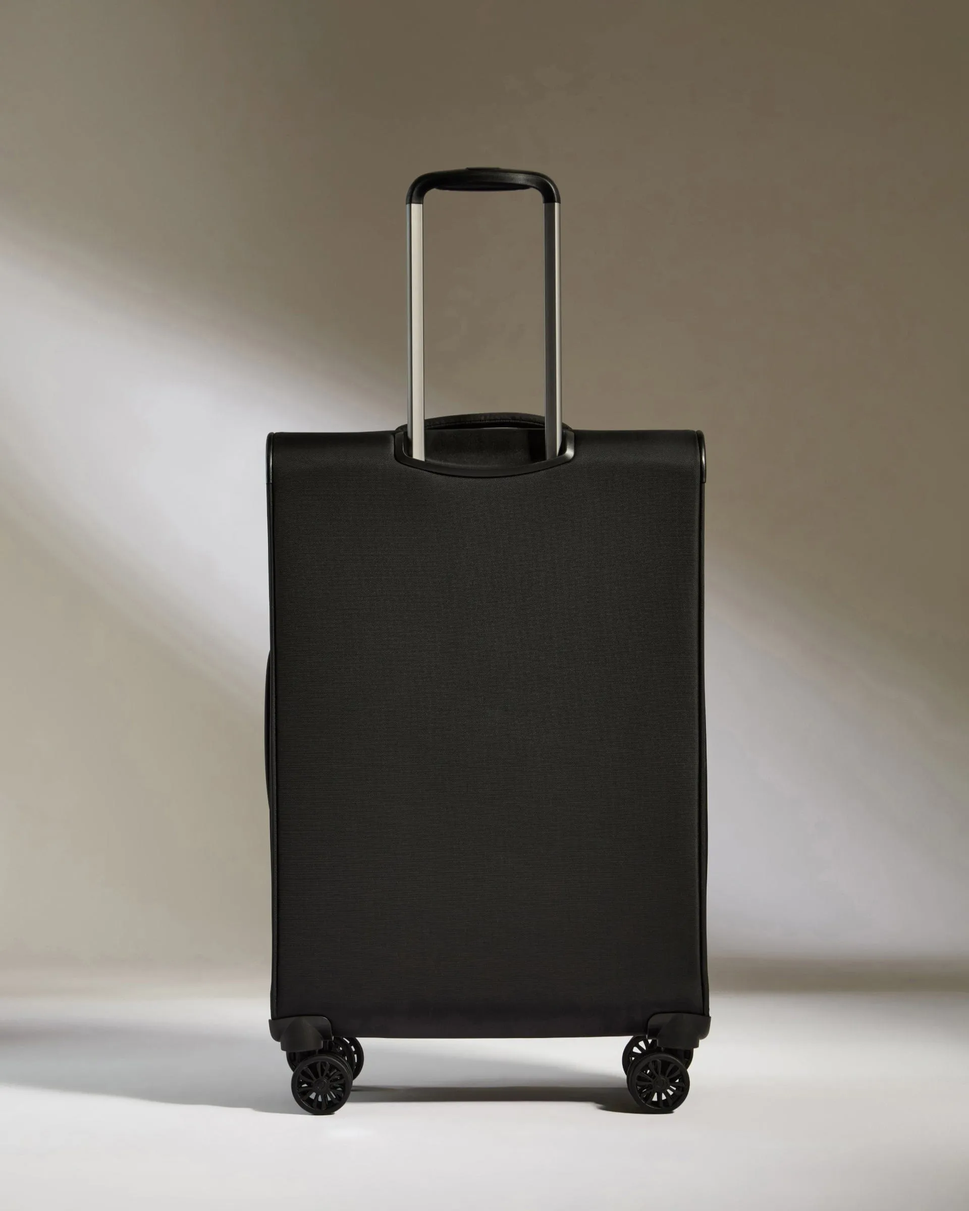 Lightest Medium Suitcase in Black - Soft Stripe