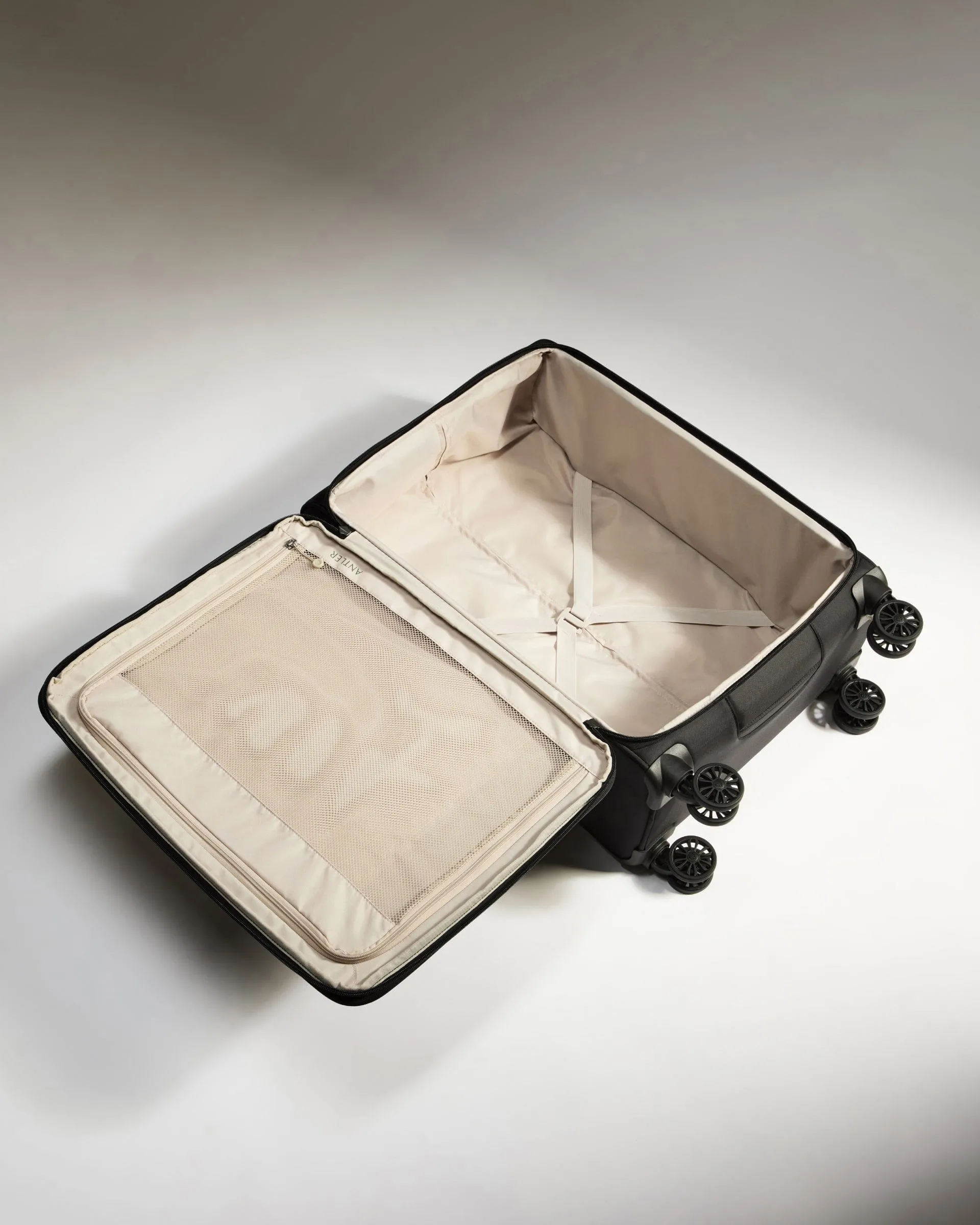 Lightest Medium Suitcase in Black - Soft Stripe